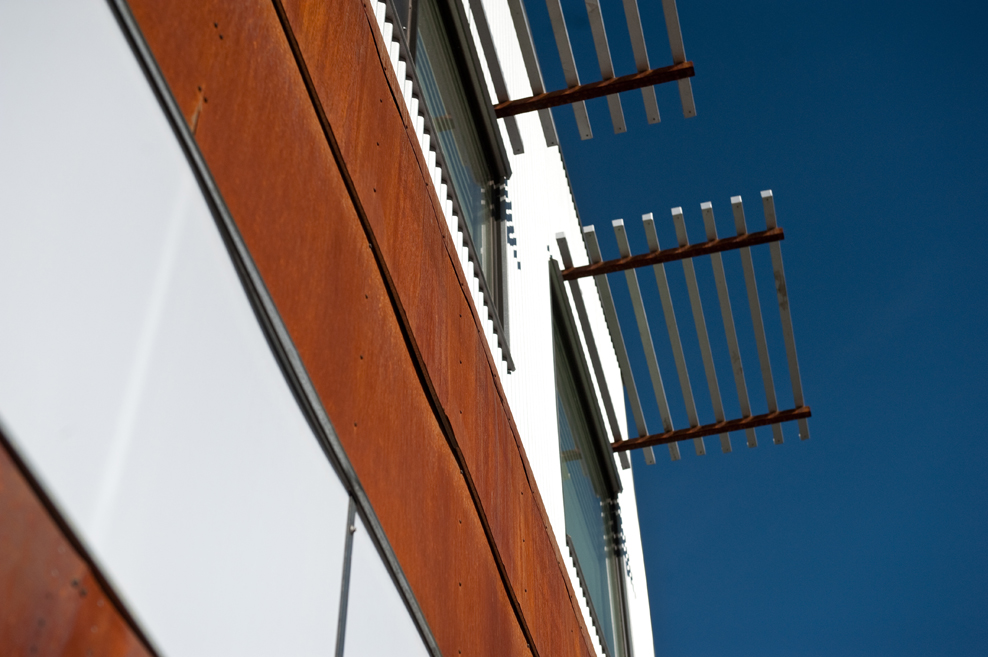 Facade detail of corten steel cladding and exterior sunshades on the Vonmod building in Denver