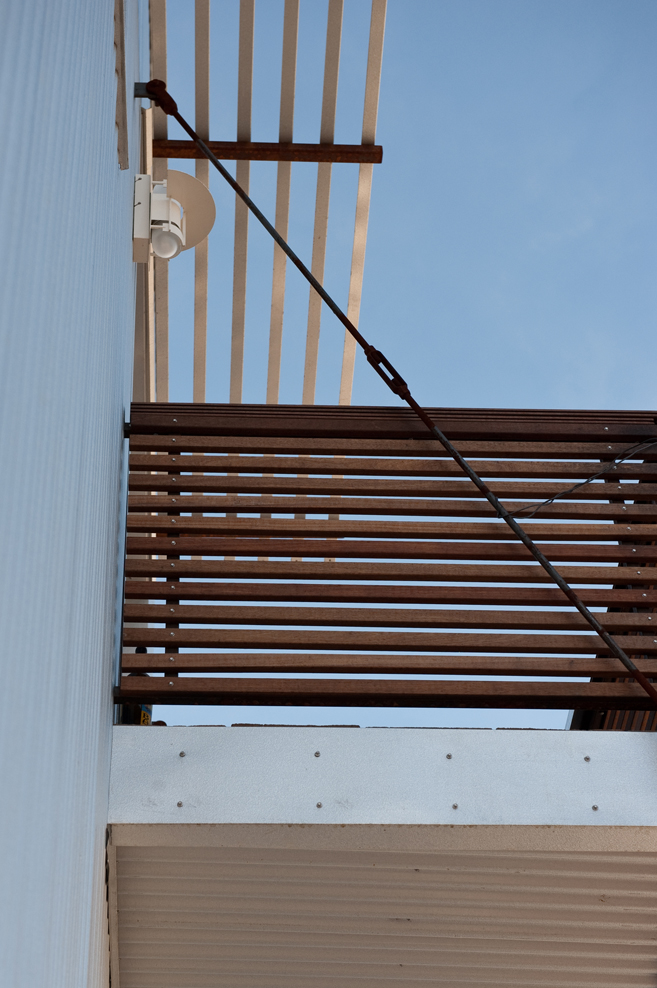 Underside detail of exterior sunshade with steel supports on the Vonmod building in Denver