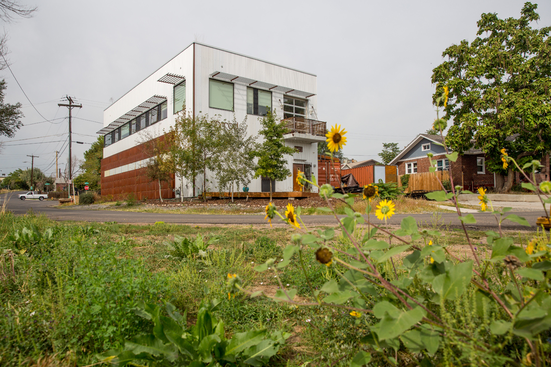 Street-level view of the Vonmod building with corrugated metal and corten steel exterior in Denver