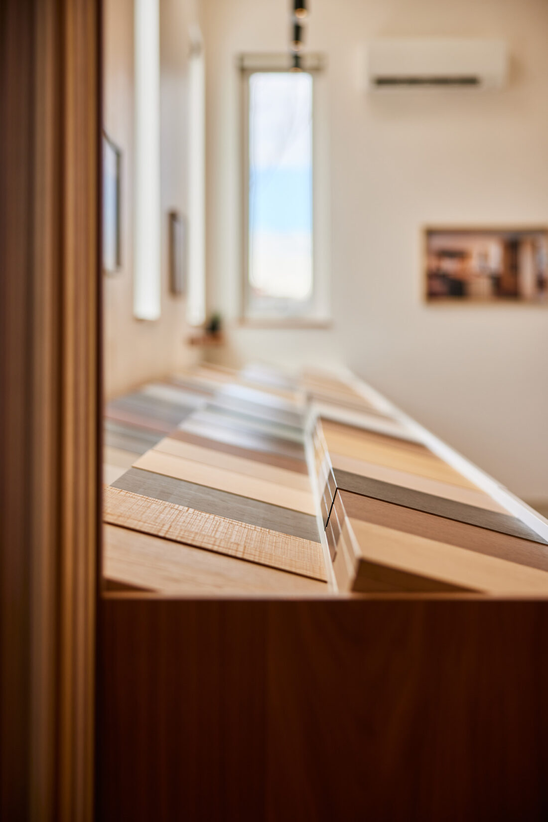 Close-up of wood and laminate material samples in Denver showroom material gallery