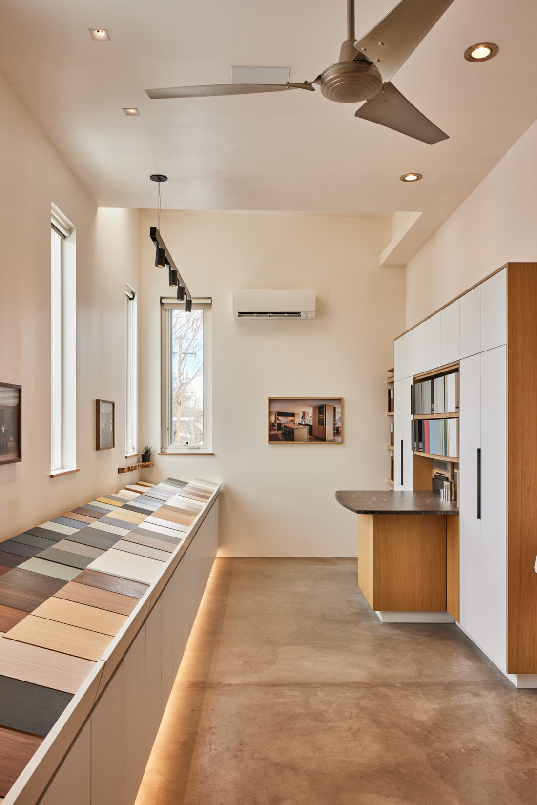 Material gallery with curated wood, laminate, and finish samples in Denver showroom